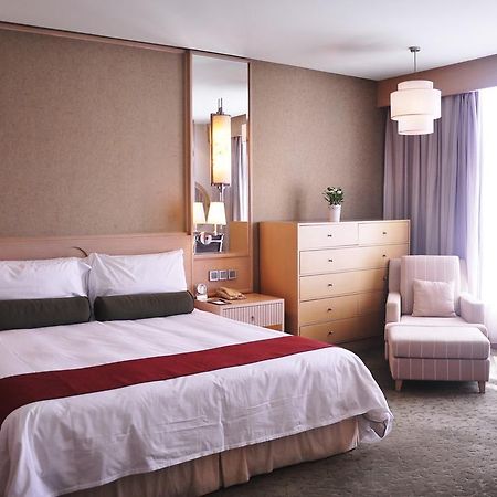 Hotel Nikko تيانجين المظهر الخارجي الصورة A bedroom at the hotel