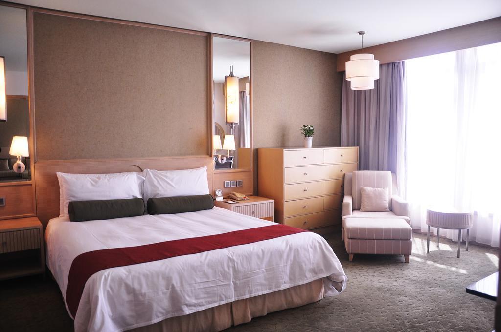 Hotel Nikko تيانجين المظهر الخارجي الصورة A bedroom at the hotel
